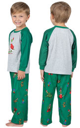 Toddler wearing Green and Gray Dr. Seuss' The Grinch Pajamas, facing away from the camera and then facing to the side image number 1