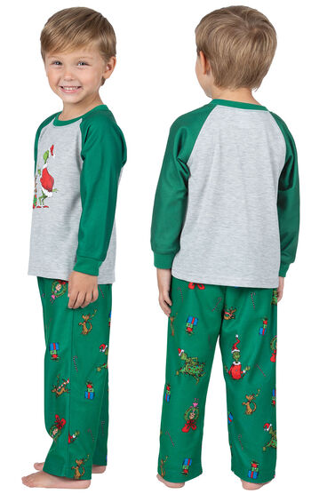 Toddler wearing Green and Gray Dr. Seuss' The Grinch Pajamas, facing away from the camera and then facing to the side