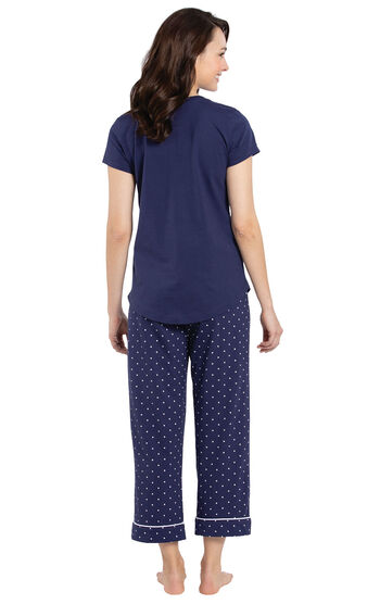 Model wearing Navy and White Short Sleeve Capri PJ for Women, facing away from the camera