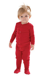 Model wearing Red Dropseat Onesie PJ for Infants