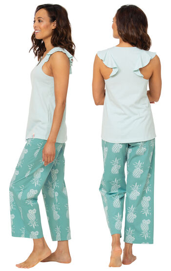 Model wearing Margaritaville Easy Island Capri PJs - Turquoise Pineapple, facing away from the camera and then facing to the side