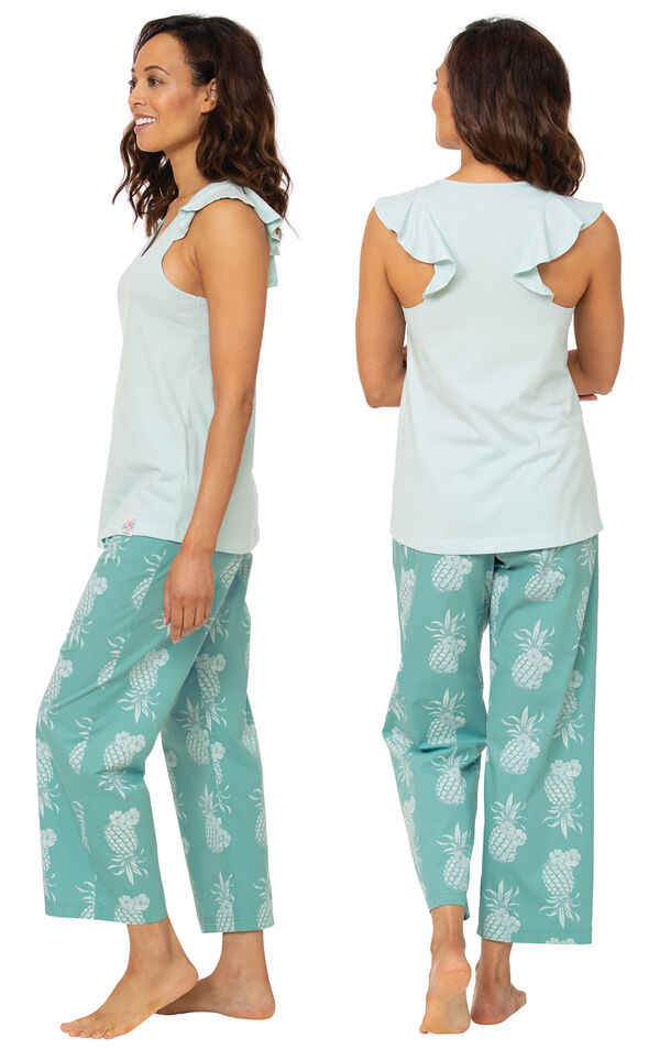 Model wearing Margaritaville Easy Island Capri PJs - Turquoise Pineapple, facing away from the camera and then facing to the side image number 1