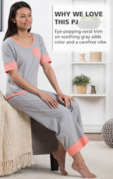 Model sitting wearing Cozy Capri Pajama Set with the following copy: Why We Love This PJ - eye-popping coral trim on soothing gray adds color and carefree vibe image number 3