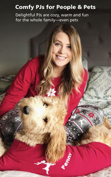 Customer Photo of woman and dog sitting on bed wearing matching Nordic pajamas. Delightful PJs are cozy, warm and fun for the whole family - even pets. image number 2