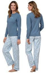 Model wearing Blue Long-sleeve top with "Let me sleep" graphic paired with Blue and White Paisley Full-length pants, facing away from the camera and then to the side image number 1