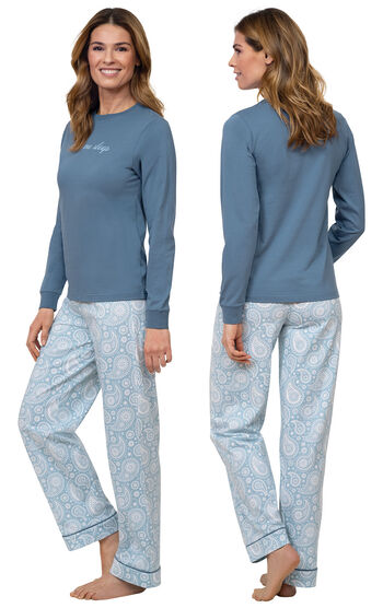 Model wearing Blue Long-sleeve top with "Let me sleep" graphic paired with Blue and White Paisley Full-length pants, facing away from the camera and then to the side