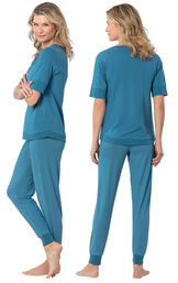 Model wearing Teal Jogger Pajamas for Women, facing away from the camera and then to the side image number 1