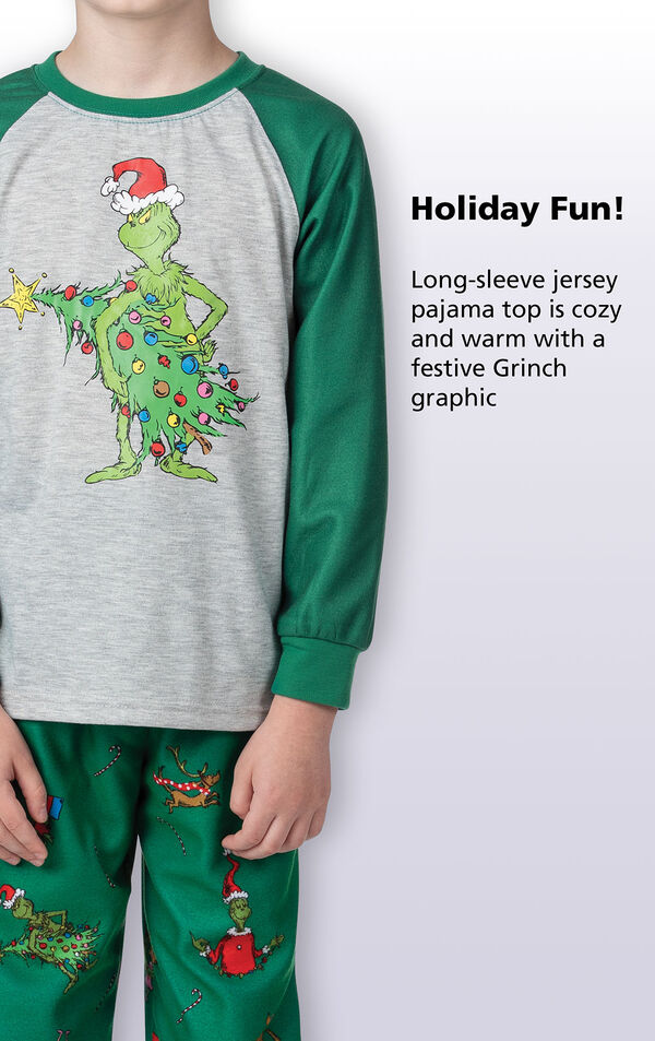 Close-up of Dr. Seuss' The Grinch PJ Long-Sleeve Top with the following copy: Holiday fun! Long-sleeve jersey pajama top is cozy and warm with a festive Grinch graphic. image number 3