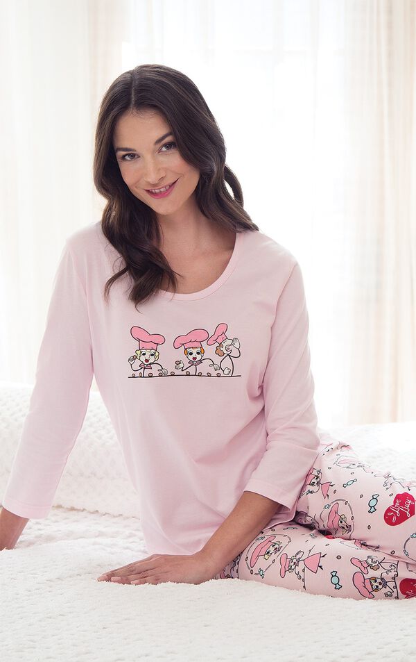 Model sitting on bed wearing Pink and Red "I Love Lucy" Chocolate Factory Pajamas image number 4