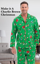 Model wearing Charlie Brown Christmas Men's Pajamas by a couch with the following copy: Make it A Charlie Brown Christmas image number 2
