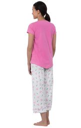 Model wearing Pink and White Flamingo Capri PJ for Women, facing away from the camera image number 1