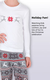 Close-up of Long-sleeve top with the following copy: Holiday fun! Matching Kids pajamas bring comfort, joy and lots of fun to the Christmas celebration image number 1