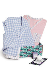 Periwinkle Blue Gingham Boyfriend PJs & Pink and Blue striped Henley PJs in a blue and pink floral box with a bath bomb image number 0