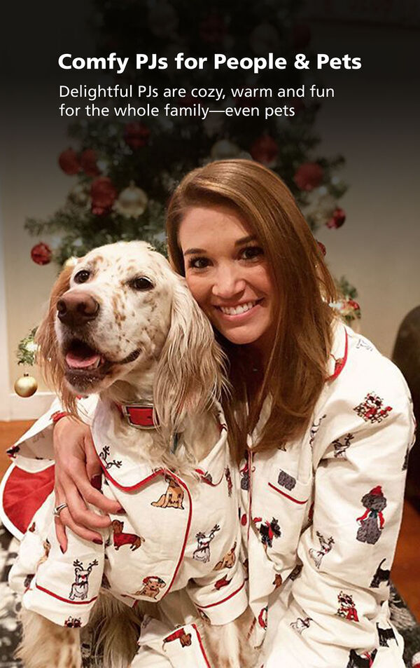 Customer Photo of woman and Dog wearing matching Christmas Dog Print Flannel Pajamas and the following copy: Comfy PJs for People and Pets image number 3