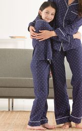 Mother and daughter wearing matching Navy Blue with White Dots Classic Polka-Dot Pajamas image number 1