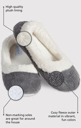 Close up of the Gray World's Softest Slipper with the following copy: High quality plush lining adds warmth and a touch of glamour. Non-marking soles are great for around the house. The softest pile fleece and an extra-padded footbed image number 1