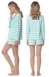Model wearing Blue Margaritaville Long Sleeve Striped Short Set for Women, facing away from the camera and then to the side image number 1