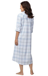 Model wearing Blue Plaid Gown for Women, facing away from the camera image number 1