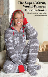 Model sitting down wearing Nordic Fleece Hoodie-Footie with the following copy: The Super-Warm, World-Famous Hoodie-Footie. Head-to-toe warmth, cozy in no time image number 2