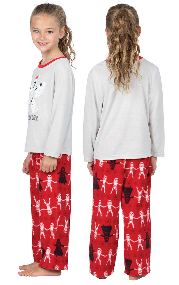 Model wearing Red Star Wars PJ for Girls, facing away from the camera and then to the side