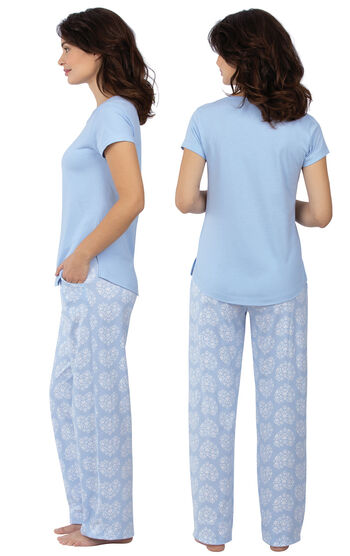 Model wearing Light Blue Paw Print Heart PJ for Women, facing away from the camera and then to the side
