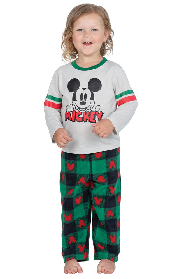 Model wearing red and green mickey mouse holiday pajamas image number 0