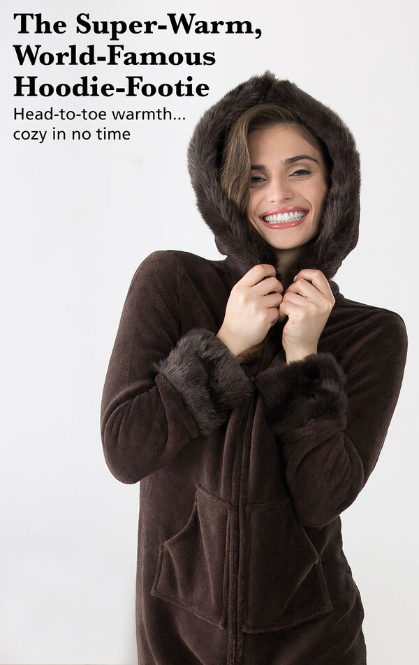 Model wearing Mink Chocolate Hoodie-Footie with the hood up with the following copy:  The Super-Warm, World-Famous Hoodie-Footie. Head-to-toe warmth, cozy in no time image number 1