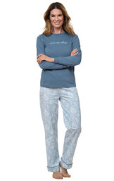 Model wearing Blue Long-sleeve top with "Let me sleep" graphic paired with Blue and White Paisley Full-length pants image number 0