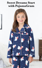 Polar Bear Fleece Girls Pajamas by bed with the following copy: Sweet Dreams Start with PajamaGram image number 2