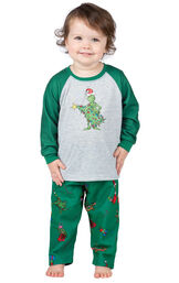Model wearing Green and Gray Grinch PJ for Infants