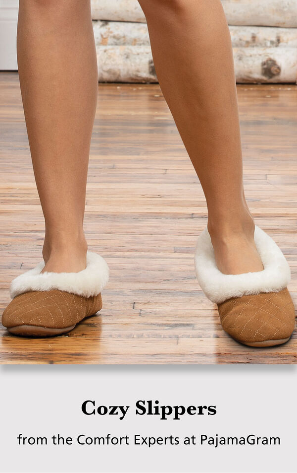 Model wearing slippers with the following copy: Cozy Slippers from the Comfort Experts at PajamaGram image number 2