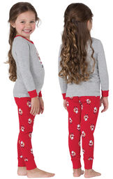 Model wearing  St. Nick Toddler Pajamas, facing away from the camera and then facing to the side image number 1