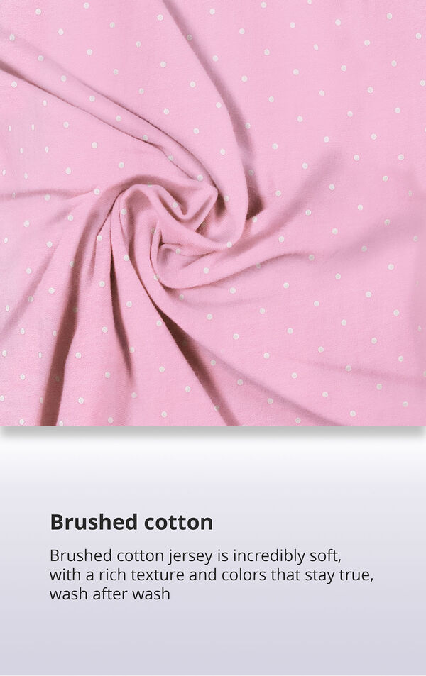 Pink Polka Dot Fabric Swatch with the following copy: Brushed cotton jersey is soft, inside and out. Machine washable cotton jersey won't fade or thin out. High-quality fabric means colors stay bright. Comfy mid-weight fabric is breathable. image number 4