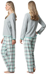 Model wearing Aqua Plaid Fleece PJ for Women, facing away from the camera and then to the side image number 1