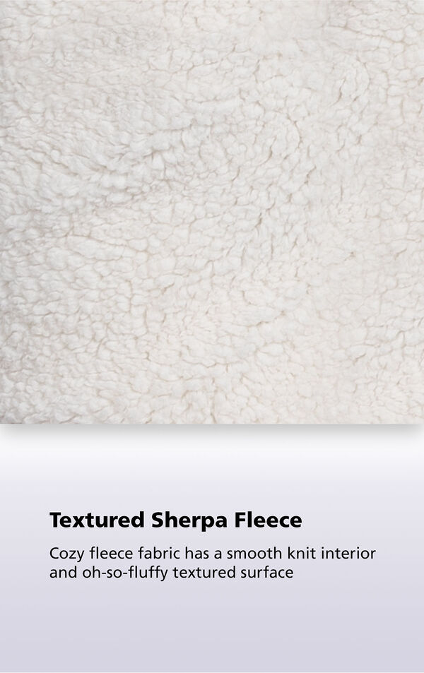 Close-up of the textured sherpa fleece with the following copy: Cozy fleece fabric has a smooth knit interior and oh-so-fluffy textured surface image number 4