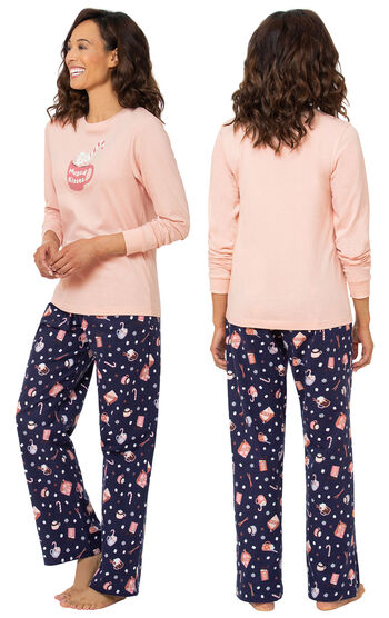 Model wearing Pink and Navy Blue Mugs & Kisses Pajamas, facing away from the camera and then facing to the side