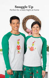 Couple wearing Dr. Seuss' The Grinch&trade; His & Hers Matching Pajamas image number 1