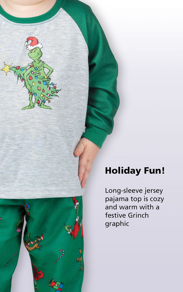 Close-up of Dr. Seuss' The Grinch PJ Long-Sleeve Top with the following copy: Holiday fun! Long-sleeve jersey pajama top is cozy and warm with a festive Grinch graphic. image number 2