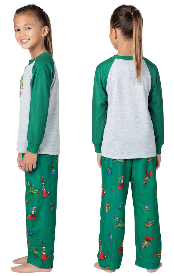 Model wearing Green and Gray Dr. Seuss' The Grinch™ Girls Pajamas, facing away from the camera and then facing to the side image number 1