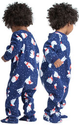 Model wearing Navy Polar Bear Fleece Onesie PJ for Infants, facing away from the camera and then facing to the side image number 1
