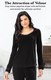 Model wearing Velour Long-Sleeve Pajamas - Black by bed with the following copy: The Attraction of Velour. Cozy velour pajamas drape with perfection and stretch for ultimate comfort image number 2