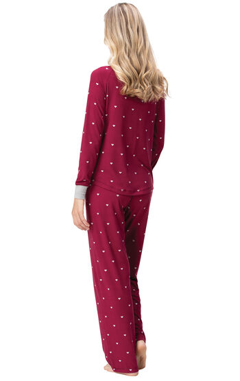Model wearing Whisper Knit Henley Pajamas - Garnet Hearts, facing away from the camera
