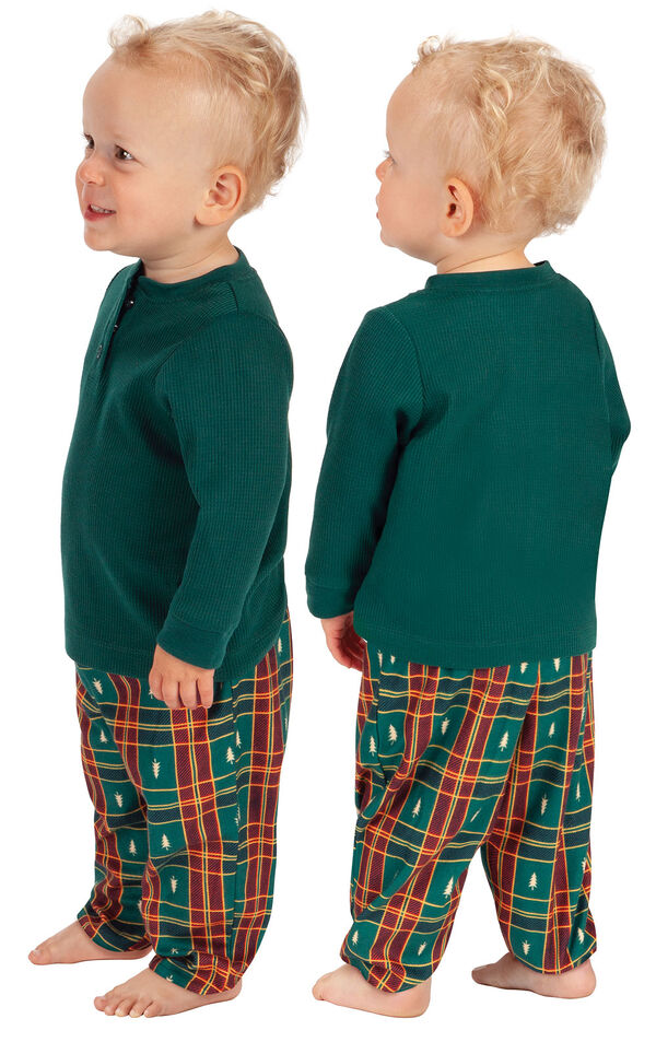 Model wearing Red and Green Christmas Tree Plaid Thermal Top PJ for Infants, facing away from the camera and then to the side image number 1