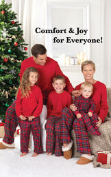 Parents and children sitting by Christmas tree wearing Red Stewart Plaid Thermal-Top Pajamas. Headline: Comfy and Joy for Everyone! image number 1