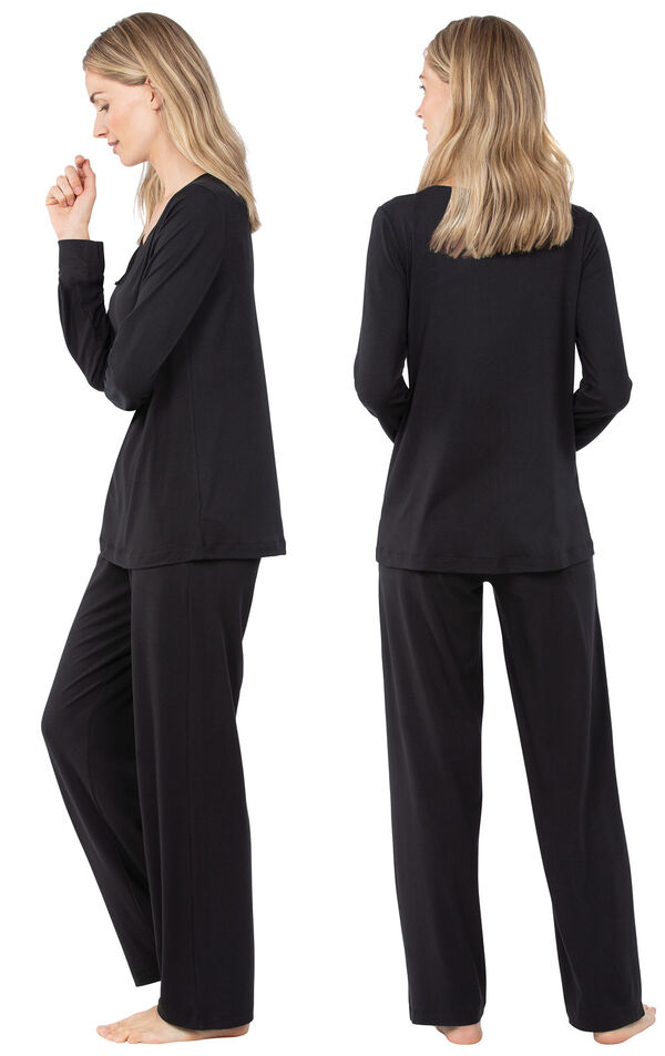 Model wearing Black Tie-Neck PJ for Women, facing away from the camera and then to the side image number 1