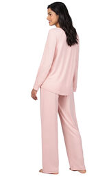 Model wearing Pink Tie-Neck Pajamas for Women, facing away from the camera image number 1