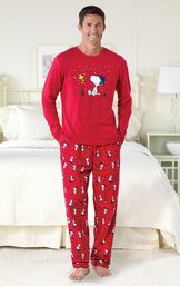 Model standing by bed wearing Red Snoopy and Woodstock Men's Pajamas image number 1