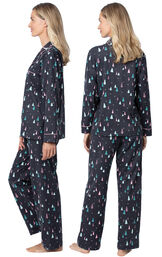 Model wearing Black with Bright Tree Print Button-Front PJ for Women, facing away from the camera and then facing to the side image number 1