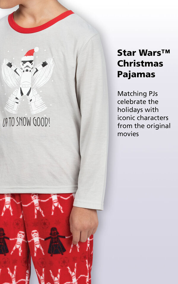 Graphic long-sleeve top reads ''Up To Snow Good'' while Darth Vader looms over a snowman Stormtrooper. Copy reads: Matching PJs celebrate the holidays with iconic characters from the original movies. image number 2