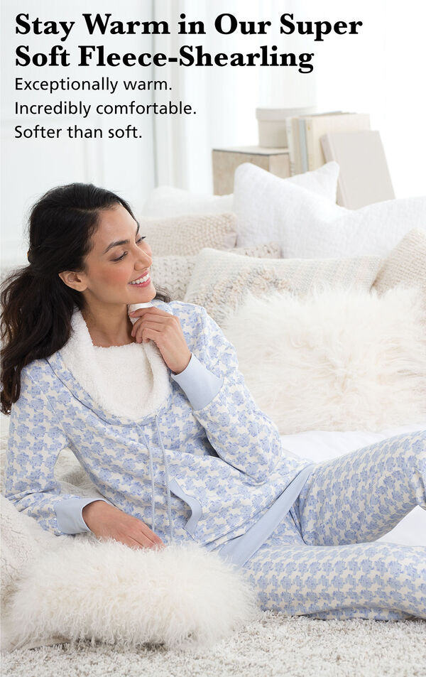 Model sitting on a bed wearing Snow Day Shearling Rollneck Pajama Set  with the following copy: Stay warm in our Super-Soft Fleece-Shearling. Exceptionally warm, incredibly comfortable, softer than soft. image number 2